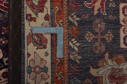 Backside of handmade 1970s Shiraz rug showing knot structure and weave density
