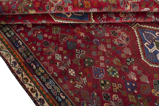 Corner detail of 1970s Shiraz rug showing border pattern and Wool pile