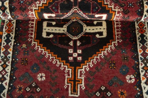 Full view of 2000s Shiraz rug from Iran / Persia, 124 × 72 cm in Red tones