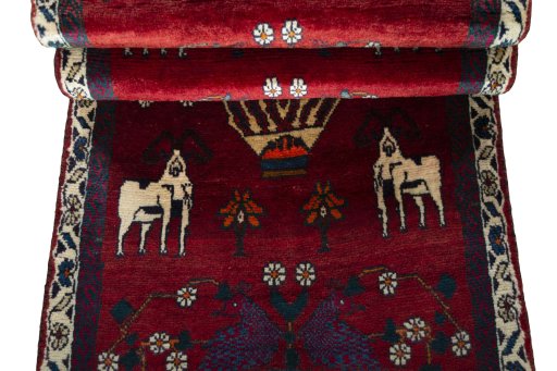 Corner detail of 2000s Shiraz rug showing border pattern and Wool pile