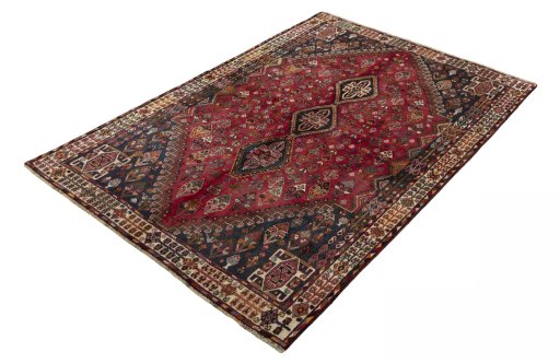Corner detail of 2000s Shiraz rug showing border pattern and Wool pile