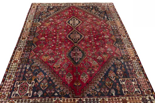 Surface texture of 2000s Shiraz rug with natural Wool and intricate pattern