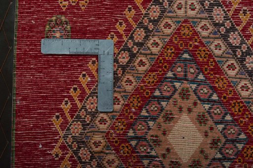Backside of handmade 2000s Shiraz rug showing knot structure and weave density