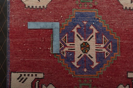 Backside of handmade 2000s Shiraz rug showing knot structure and weave density