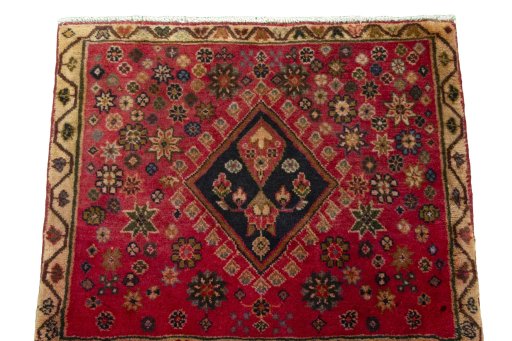 Surface texture of 2000s Shiraz rug with natural Wool and intricate pattern