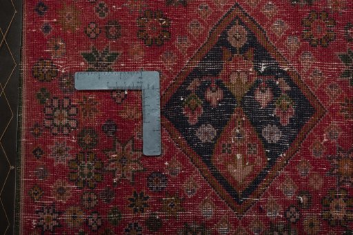 Backside of handmade 2000s Shiraz rug showing knot structure and weave density