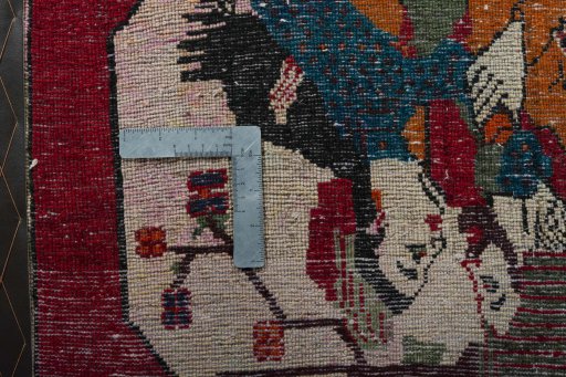 Backside of handmade 2000s Shiraz rug showing knot structure and weave density