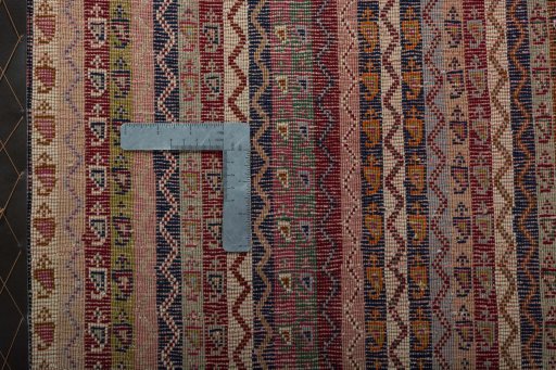 Backside of handmade 2000s Shiraz rug showing knot structure and weave density