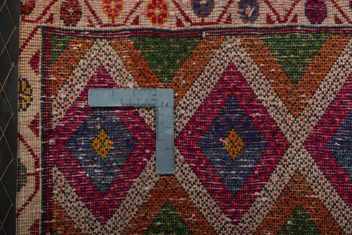 Backside of handmade 2000s Shiraz rug showing knot structure and weave density