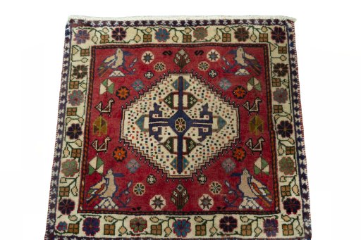 Surface texture of 2000s Shiraz rug with natural Wool and intricate pattern