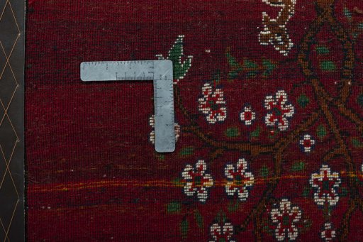 Backside of handmade 2000s Shiraz rug showing knot structure and weave density