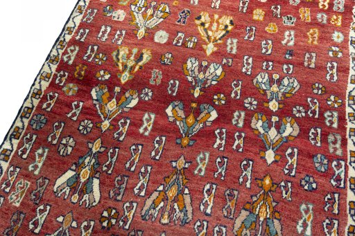 Backside of handmade 2000s Shiraz rug showing knot structure and weave density