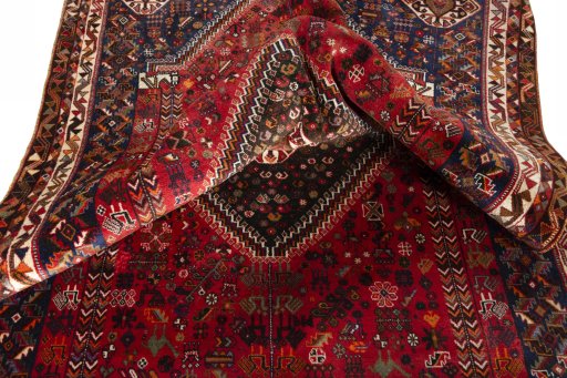 Surface texture of 2000s Shiraz rug with natural Wool and intricate pattern