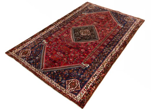 Corner detail of 2000s Shiraz rug showing border pattern and Wool pile