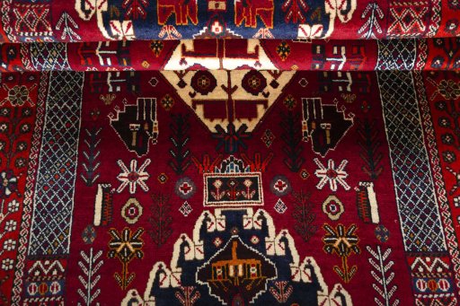 Corner detail of 2000s Shiraz rug showing border pattern and Wool pile