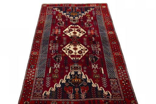 Surface texture of 2000s Shiraz rug with natural Wool and intricate pattern