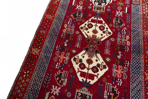 Backside of handmade 2000s Shiraz rug showing knot structure and weave density