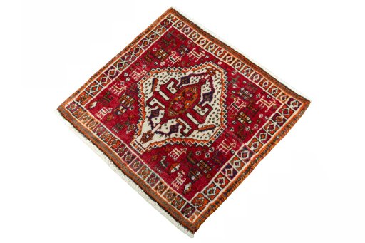 Corner detail of 2000s Shiraz rug showing border pattern and Wool pile