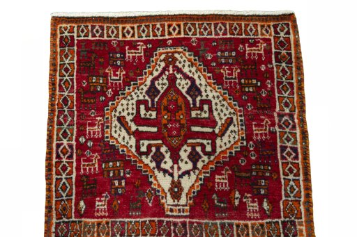 Surface texture of 2000s Shiraz rug with natural Wool and intricate pattern