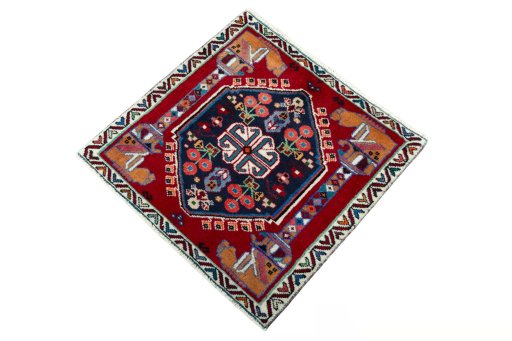 Corner detail of 2000s Shiraz rug showing border pattern and Wool pile