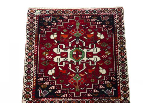 Surface texture of 2000s Shiraz rug with natural Wool and intricate pattern