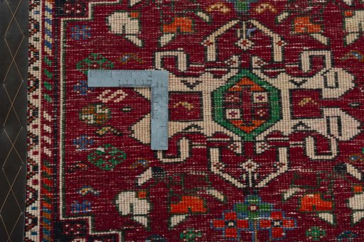 Backside of handmade 2000s Shiraz rug showing knot structure and weave density