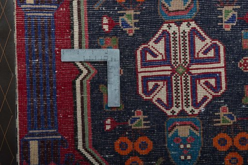 Backside of handmade 2000s Shiraz rug showing knot structure and weave density