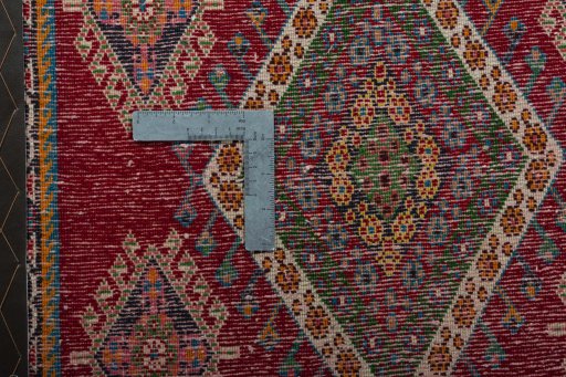 Backside of handmade 2000s Shiraz rug showing knot structure and weave density