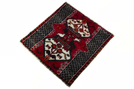 Corner detail of 2000s Shiraz rug showing border pattern and Wool pile