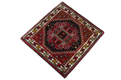 Corner detail of 2000s Shiraz rug showing border pattern and Wool pile