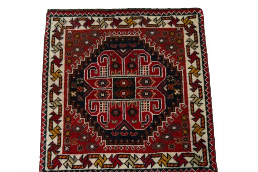 Surface texture of 2000s Shiraz rug with natural Wool and intricate pattern