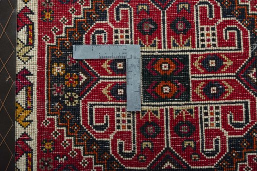Backside of handmade 2000s Shiraz rug showing knot structure and weave density