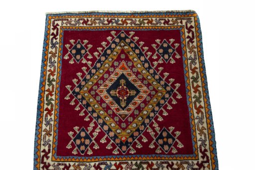 Surface texture of 2000s Shiraz rug with natural Wool and intricate pattern