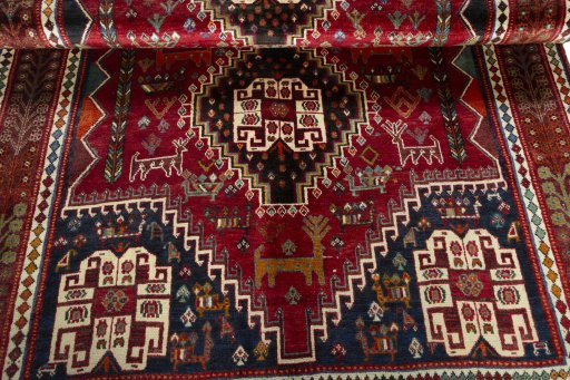 Corner detail of 2000s Shiraz rug showing border pattern and Wool pile