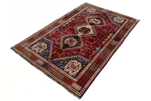 Corner detail of 2000s Shiraz rug showing border pattern and Wool pile