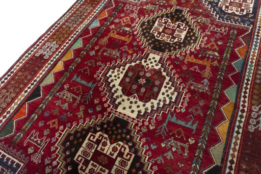 Backside of handmade 2000s Shiraz rug showing knot structure and weave density