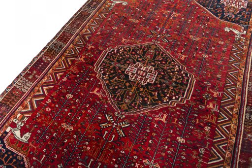 Backside of handmade 2000s Shiraz rug showing knot structure and weave density