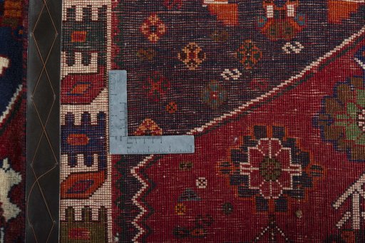 Surface texture of 2000s Shiraz rug with natural Wool and intricate pattern