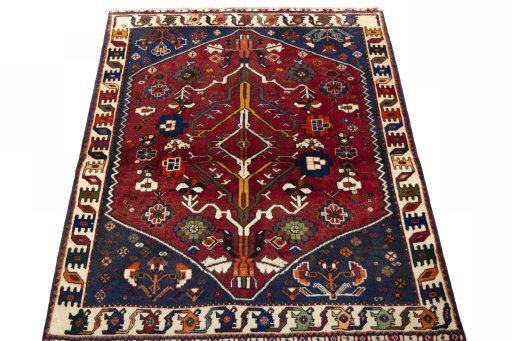Surface texture of 2000s Shiraz rug with natural Wool and intricate pattern