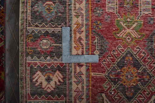 Backside of handmade 2000s Shiraz rug showing knot structure and weave density