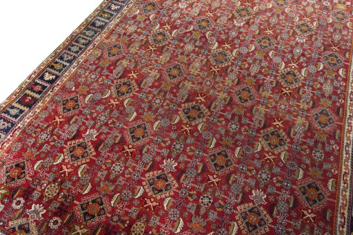 Backside of handmade 2000s Shiraz rug showing knot structure and weave density