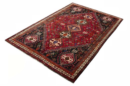 Corner detail of 2000s Shiraz rug showing border pattern and Wool pile