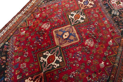 Backside of handmade 2000s Shiraz rug showing knot structure and weave density