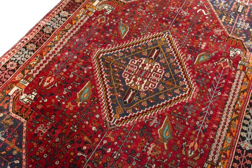 Backside of handmade 2000s Shiraz rug showing knot structure and weave density