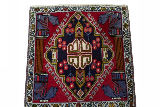 Surface texture of 2000s Shiraz rug with natural Wool and intricate pattern