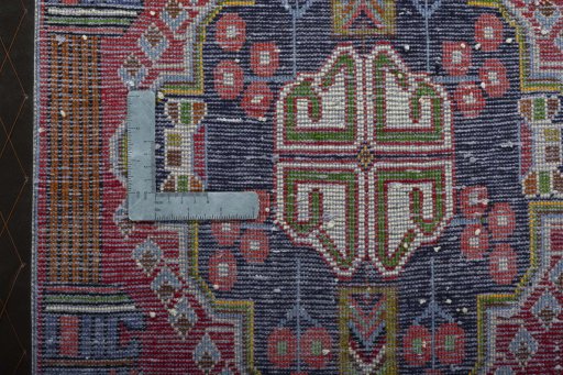Backside of handmade 2000s Shiraz rug showing knot structure and weave density
