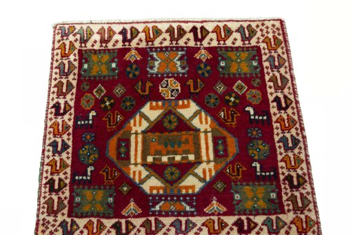 Surface texture of 2000s Shiraz rug with natural Wool and intricate pattern