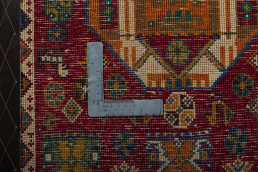 Backside of handmade 2000s Shiraz rug showing knot structure and weave density