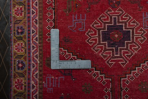 Backside of handmade 2000s Shiraz rug showing knot structure and weave density