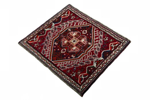 Corner detail of 2000s Shiraz rug showing border pattern and Wool pile